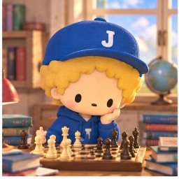 Jimmy resting his chin thoughtfully over a wooden chessboard surrounded by books